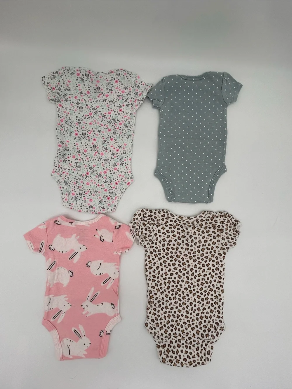 Carter’s/Child of Mine Set of 4 Onesies Size NB
